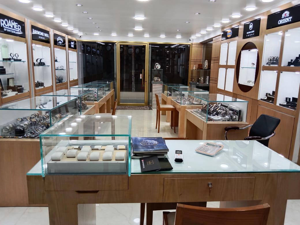 A watch movement being assembled by a watchmaker.